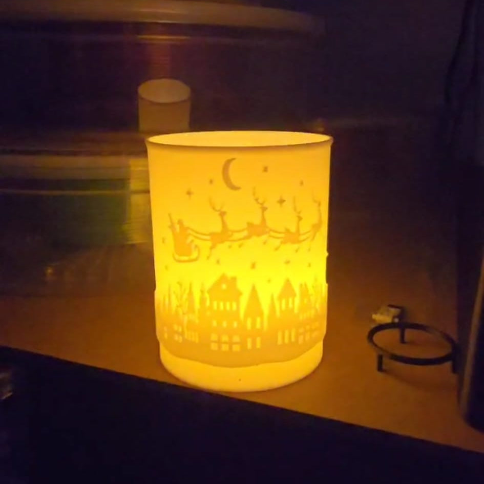 3D printed hollow Christmas tea light holder with festive cutouts, designed for LED candles only