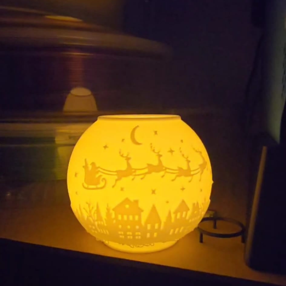 3D printed hollow Christmas tea light holder with festive cutouts, designed for LED candles only