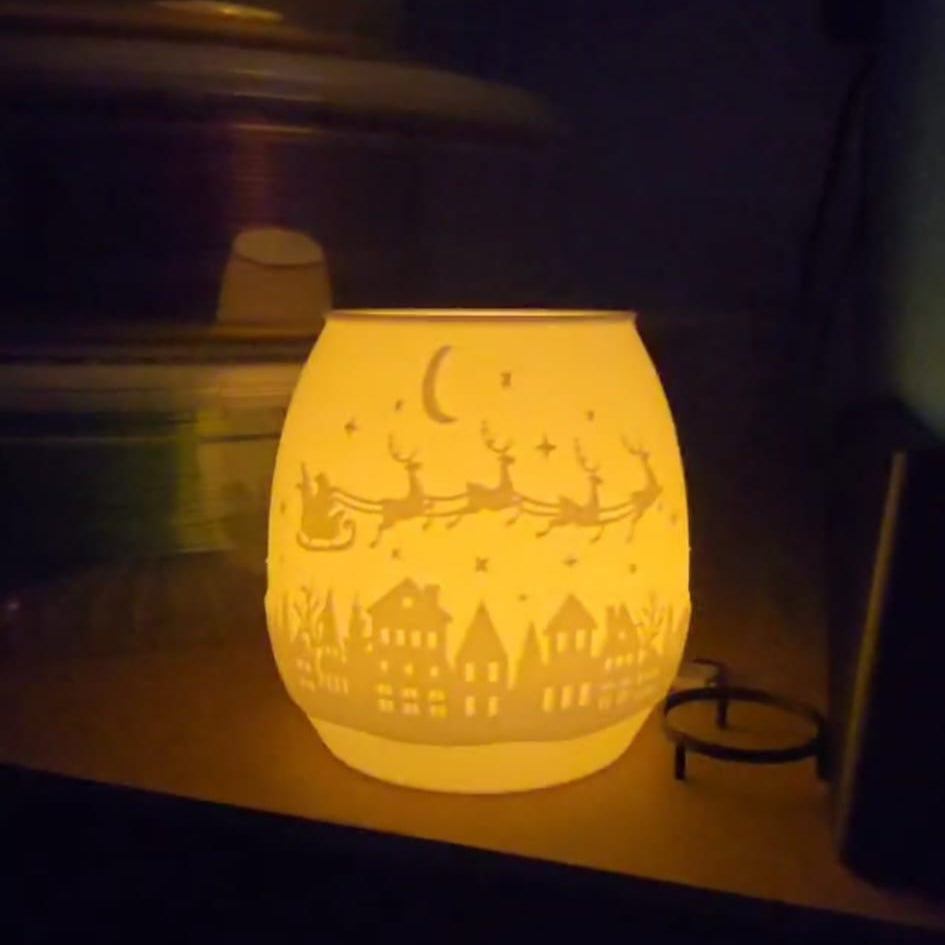 3D printed hollow Christmas tea light holder with festive cutouts, designed for LED candles only
