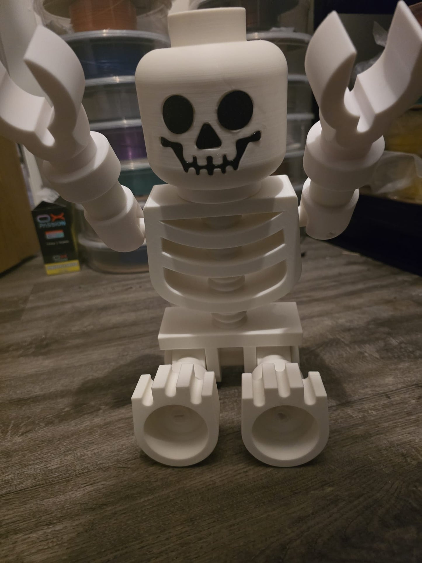 Oversized LEGO-style skeleton posed with Halloween props